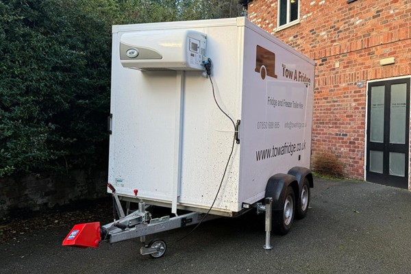 Refrigerated trailer parked outside a building